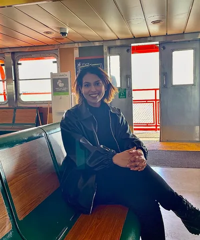 Farnaz Zinnah seated aboard a New York ferry